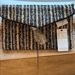 NWT!!Urban Expressions Black and Cream Textured Clutch with strap for crossbody